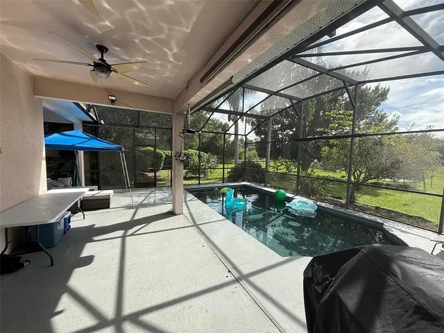 a view of swimming pool with outdoor seating