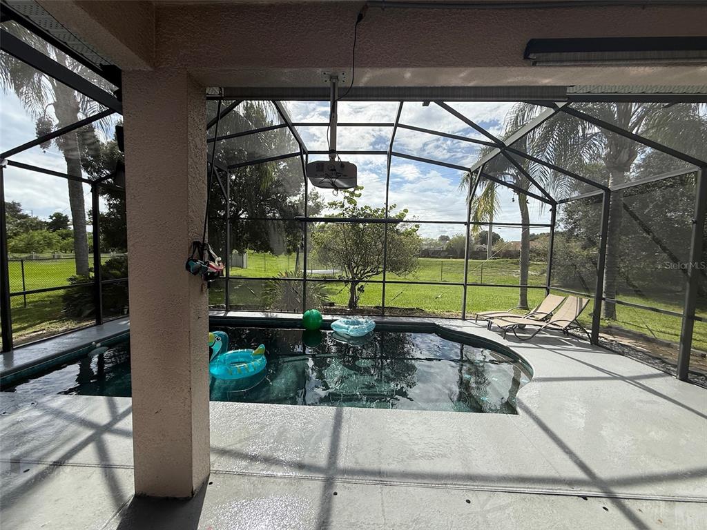 5690 Merlin Way St. Cloud, FL 34772 - Photo 39 of 46 a view of swimming pool with outdoor seating