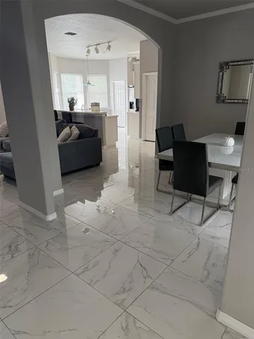 a living room with furniture and a window