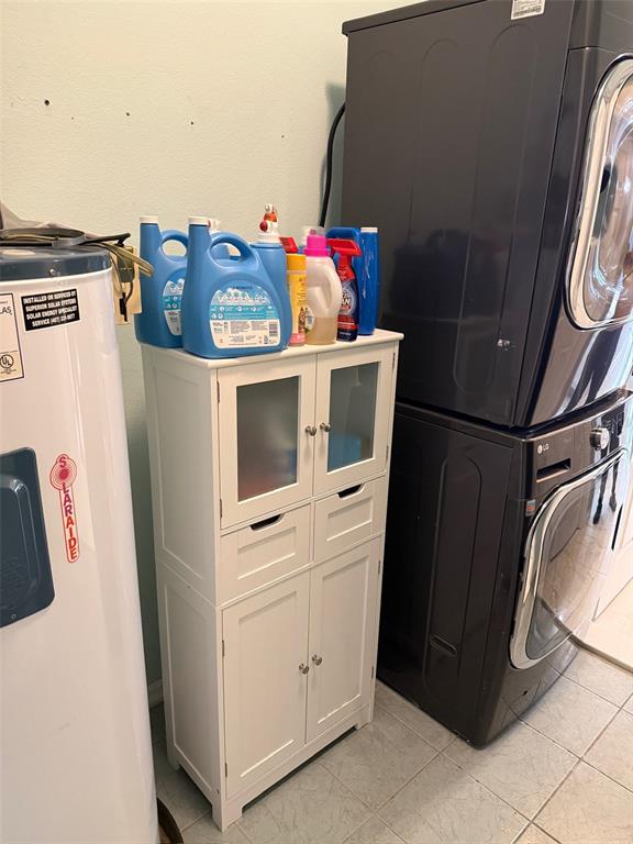 5690 Merlin Way St. Cloud, FL 34772 - Photo 45 of 46 a utility room with dryer and washer