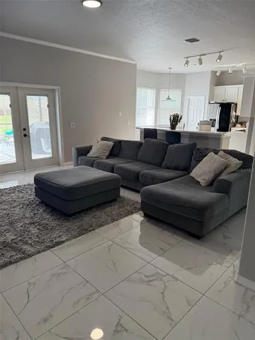 a living room with couches and a fireplace