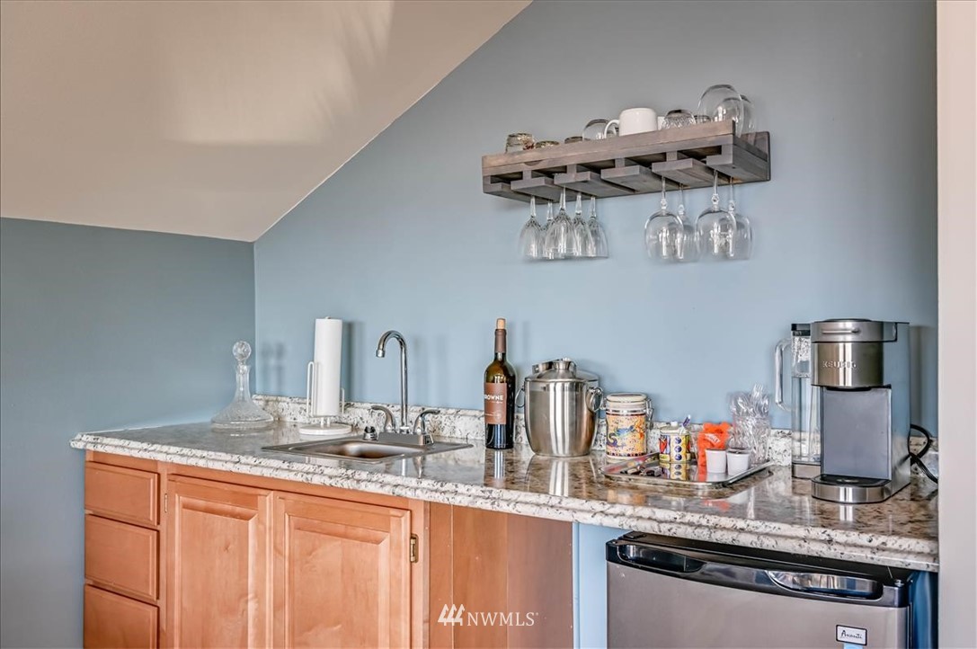 1908 Rucker Avenue Everett, WA 98201 - Photo 13 of 36 a kitchen with stainless steel appliances granite countertop a sink stove and microwave