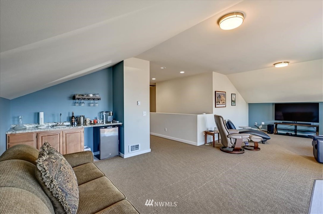 1908 Rucker Avenue Everett, WA 98201 - Photo 14 of 36 a living room with furniture and a flat screen tv