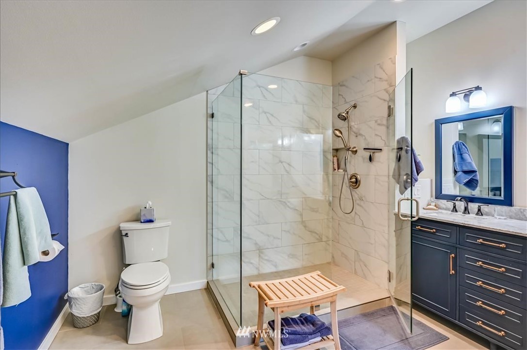 1908 Rucker Avenue Everett, WA 98201 - Photo 18 of 36 a bathroom with a toilet a sink and a shower