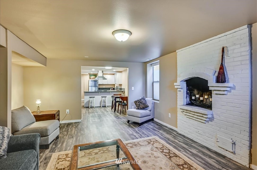1908 Rucker Avenue Everett, WA 98201 - Photo 21 of 36 a living room with furniture and a fireplace