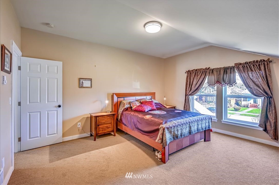 1908 Rucker Avenue Everett, WA 98201 - Photo 8 of 36 a bed room with a bed and a window