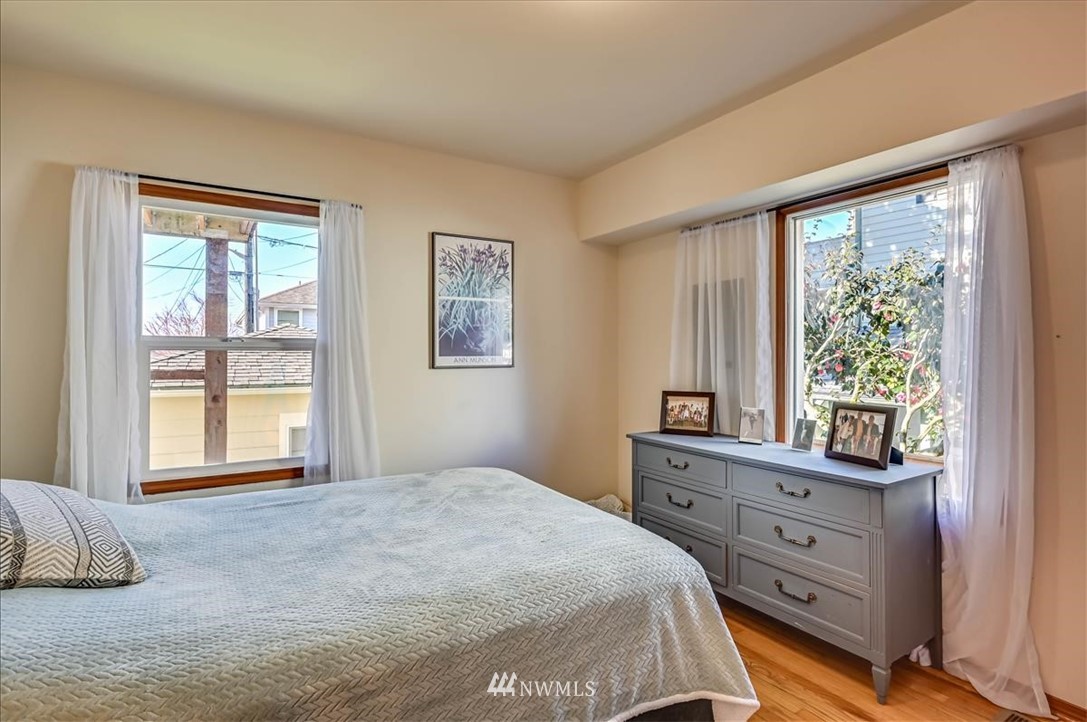 1908 Rucker Avenue Everett, WA 98201 - Photo 9 of 36 a bedroom with a bed and a window