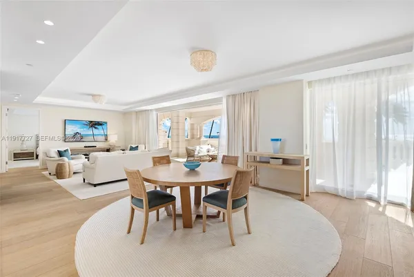 a view of a dining room with furniture and window