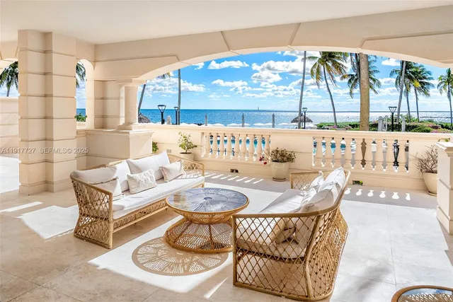 a living room with a couch and a floor to ceiling window