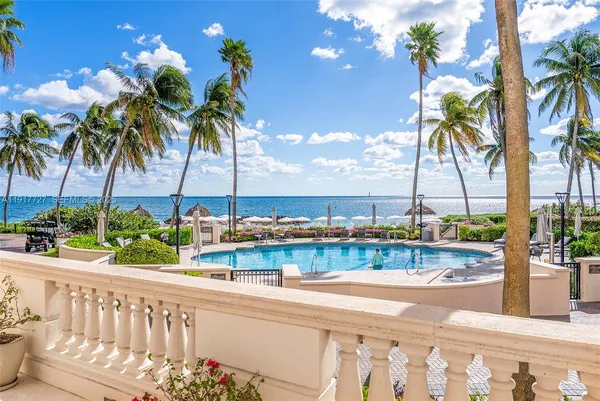 a view of a balcony with potted plants