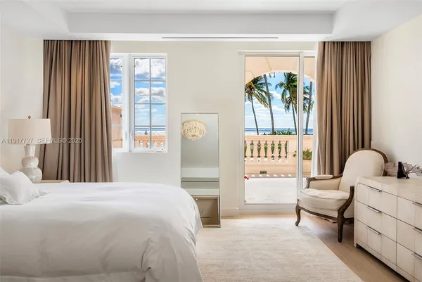 a bedroom with a bed and a chair