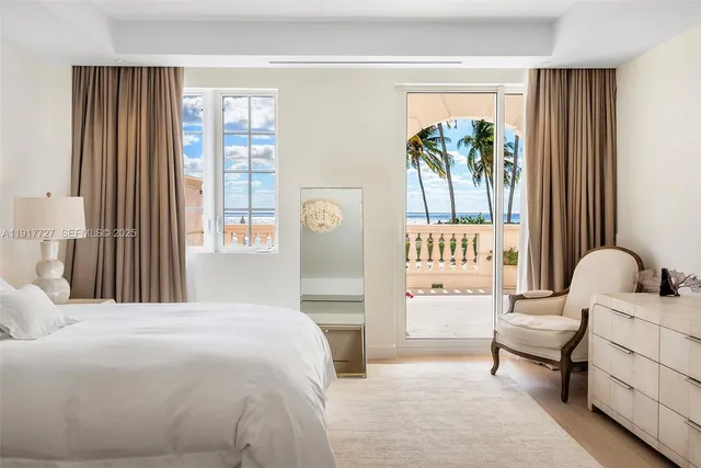 a bedroom with a bed and a chair