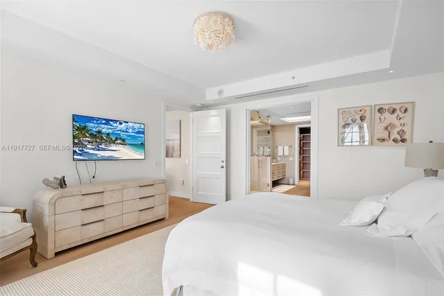 a bedroom with bed and window