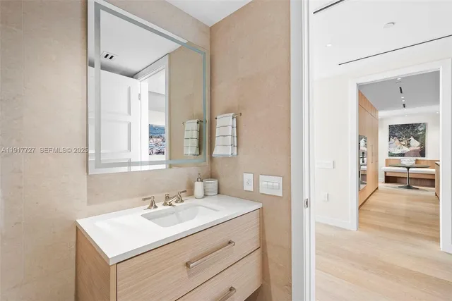 a bathroom with a sink and a mirror