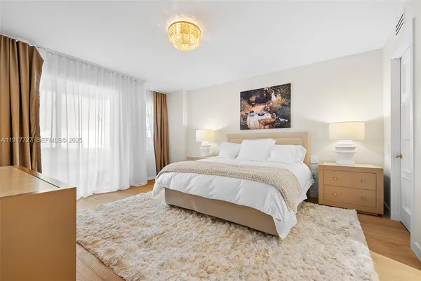 a bedroom with a bed and a cabinets