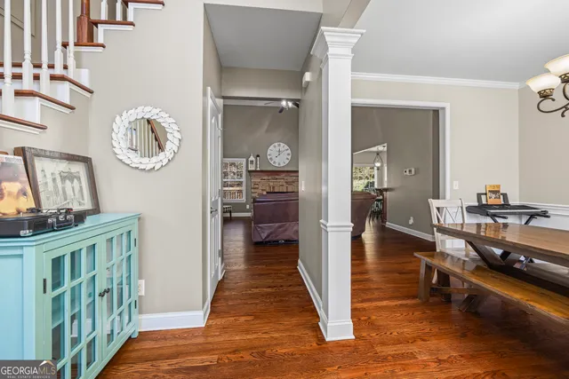 a view of a dining room with furniture window and wooden floor