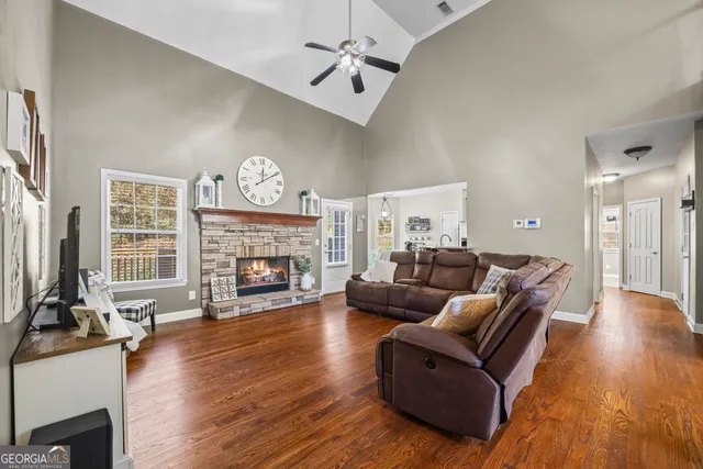 a kitchen with granite countertop a sink stove and refrigerator