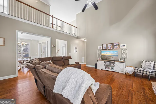 a kitchen with granite countertop a stove top oven microwave and cabinets