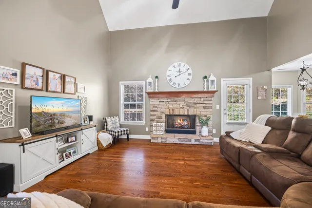a bathroom with a granite countertop sink toilet and a mirror