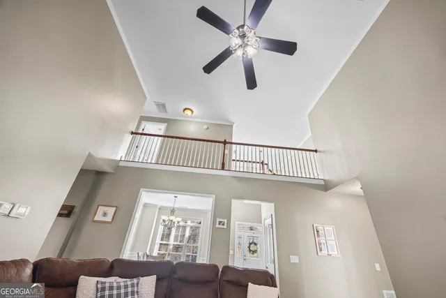 a bedroom with a bed dresser and a book shelf