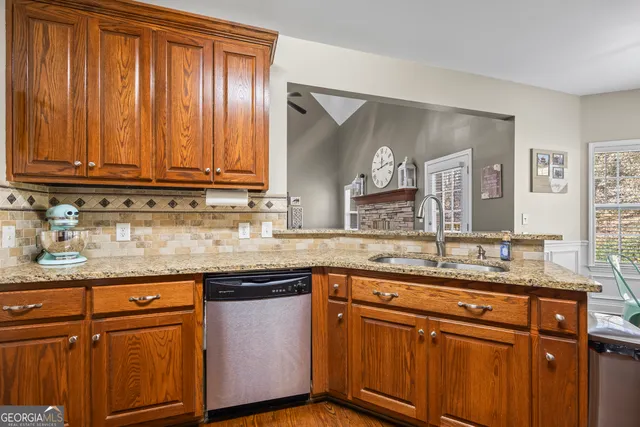 a large bed sitting in a room next to a window