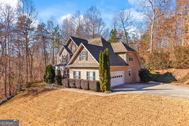 a view of an entryway with wooden floor and staircase