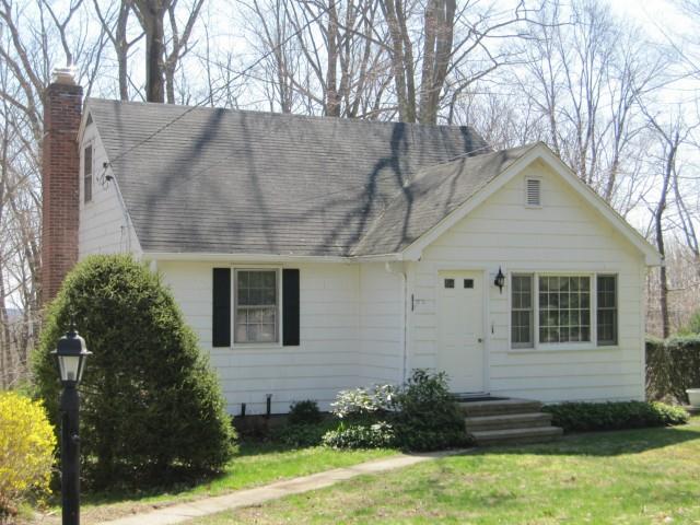 43 Pine Tree Hill Road Newtown, CT 06470 - Photo 1 of 1 a front view of a house with garden