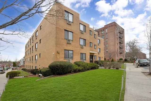 a view of a building next to a big yard