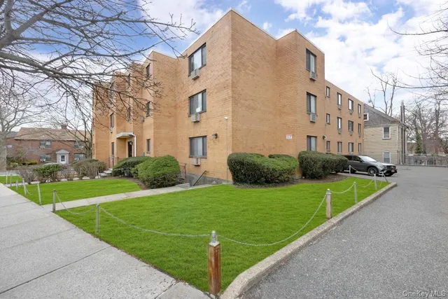 a view of a building with a yard