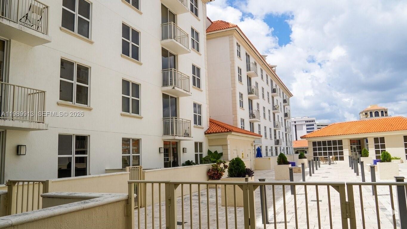 2030 Douglas Road, Unit 414 Coral Gables, FL 33134 - Photo 13 of 15 a view of a building from a balcony