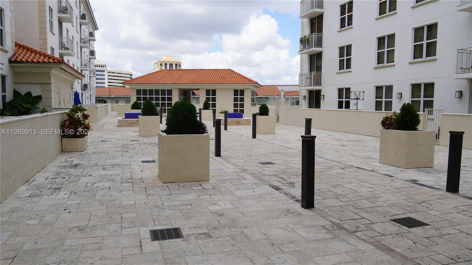 2030 Douglas Road, Unit 414 Coral Gables, FL 33134 - Photo 15 of 15 a front view of a building with street