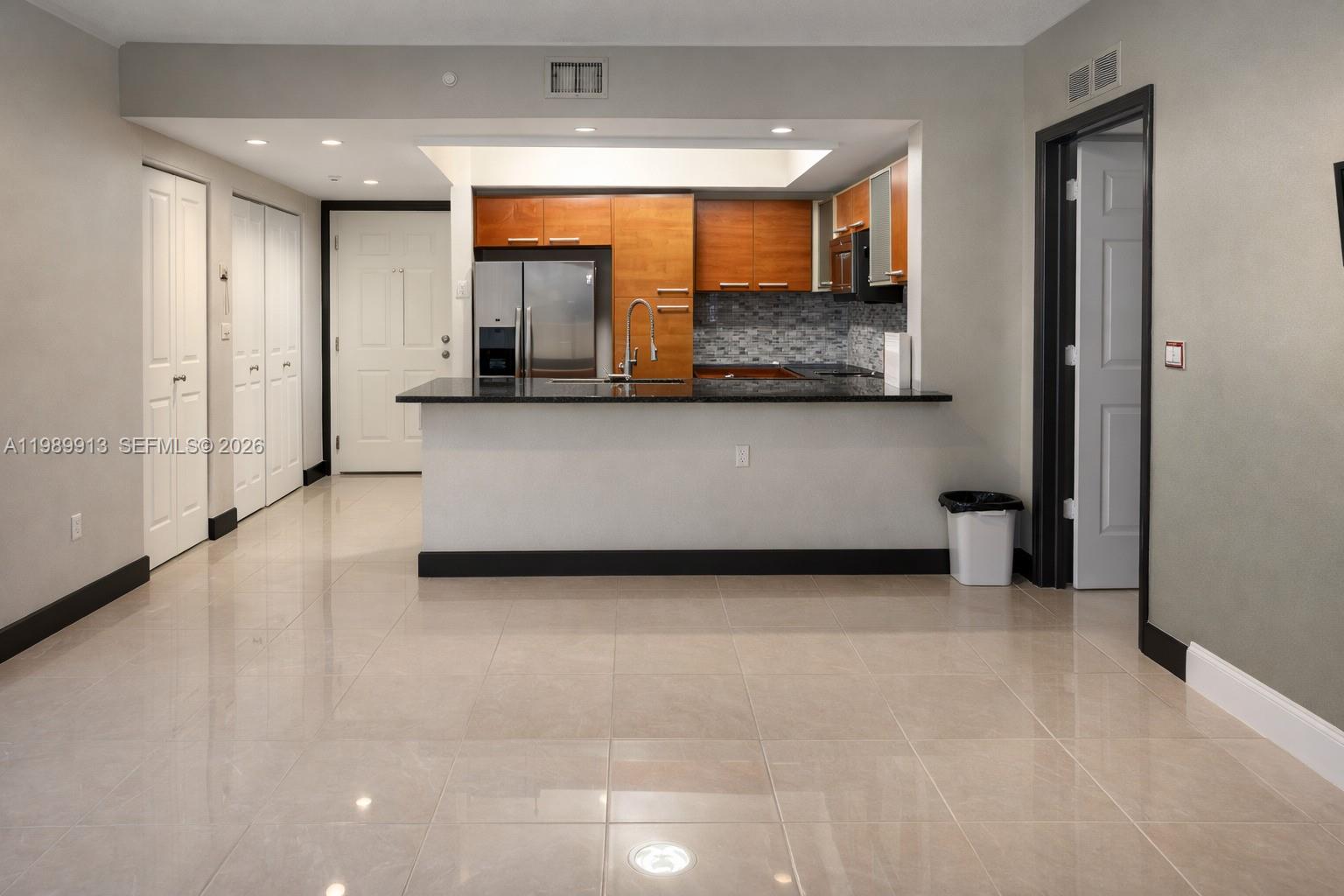 2030 Douglas Road, Unit 414 Coral Gables, FL 33134 - Photo 6 of 15 a view of kitchen with stainless steel appliances cabinets