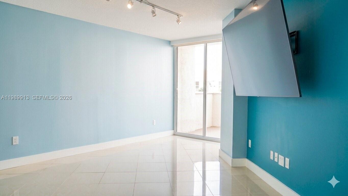 2030 Douglas Road, Unit 414 Coral Gables, FL 33134 - Photo 7 of 15 a view of an empty room and a window