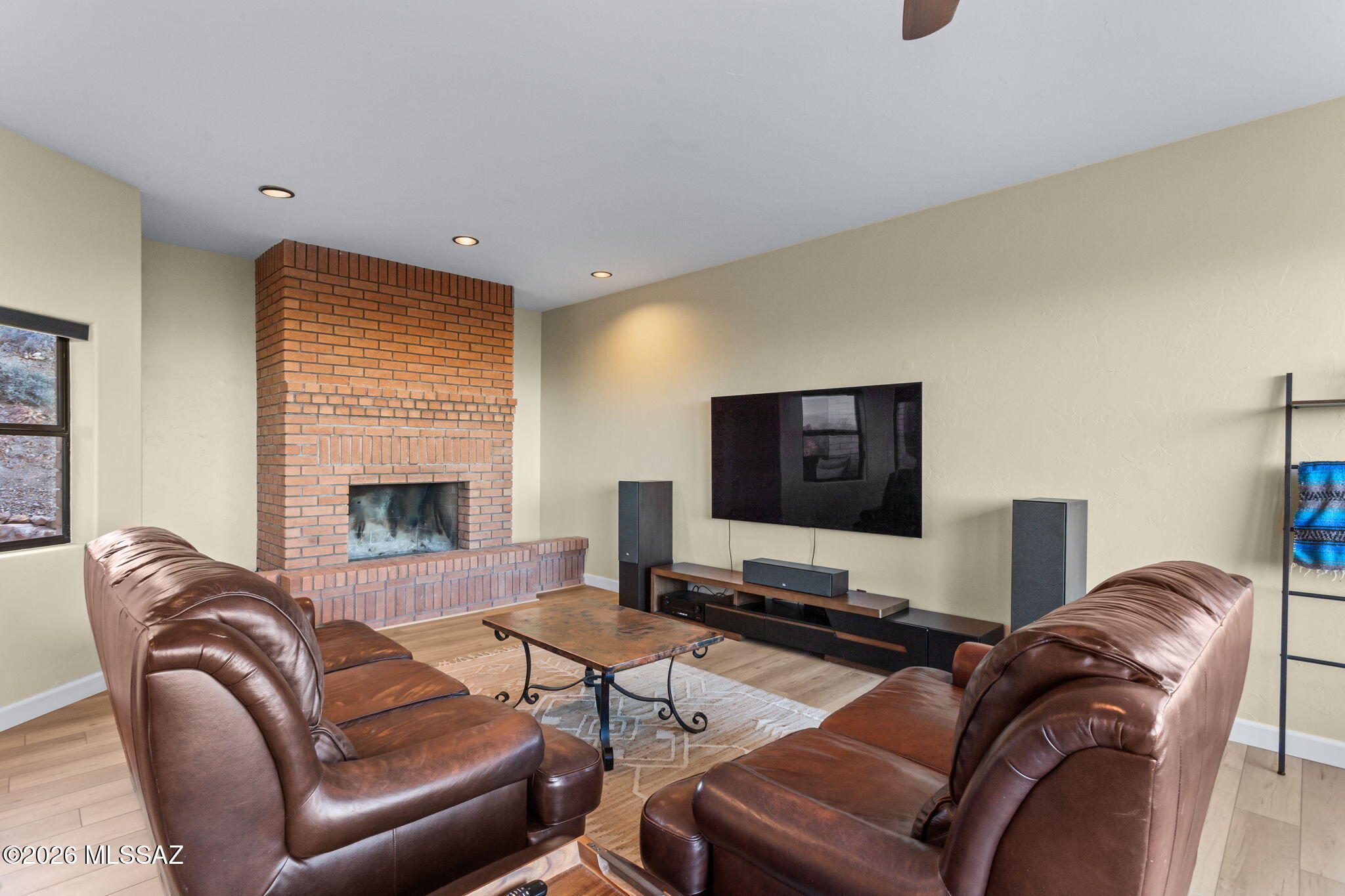 4210 West Mossman Road Tucson, AZ 85746 - Photo 10 of 51 a living room with furniture and a flat screen tv