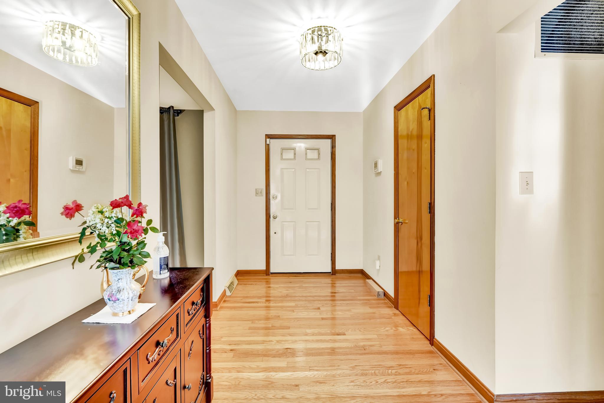 4565-10 Ten Oaks Road Dayton, MD 21036 - Photo 3 of 39 Open Foyer with polished hardwoods