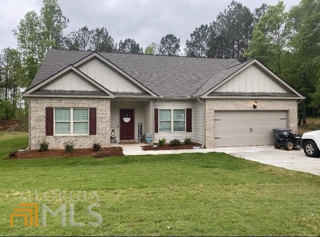 151 Fox Crossing Road Griffin, GA 30224 - Photo 1 of 1 a front view of a house with a yard and porch