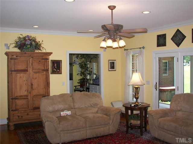 2178 Thee Hester Road Roxboro, NC 27574 - Photo 3 of 12 a living room with furniture and a chandelier