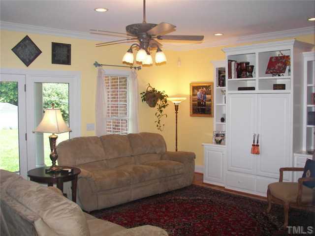 2178 Thee Hester Road Roxboro, NC 27574 - Photo 4 of 12 a living room with furniture and a chandelier