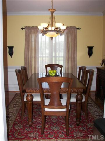 2178 Thee Hester Road Roxboro, NC 27574 - Photo 6 of 12 a view of a dining room with furniture wooden floor and chandelier