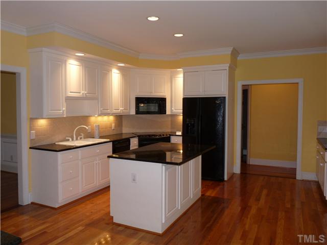 2178 Thee Hester Road Roxboro, NC 27574 - Photo 7 of 12 a kitchen with granite countertop a refrigerator and a sink