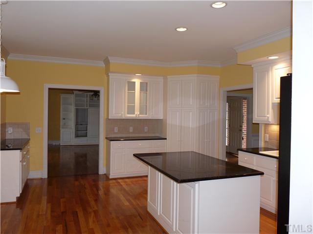 2178 Thee Hester Road Roxboro, NC 27574 - Photo 8 of 12 a kitchen that has a sink and a wooden floor
