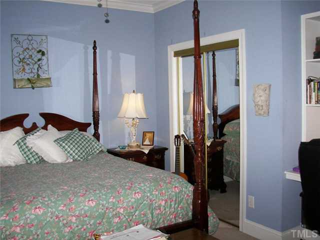 2178 Thee Hester Road Roxboro, NC 27574 - Photo 10 of 12 a bedroom with a bed window and a potted plant