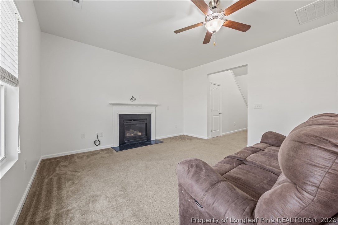 226 River Oak Street Spring Lake, NC 28390 - Photo 12 of 41 a bed room with a bed and a fireplace
