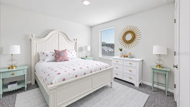 a bedroom with a bed and a dresser