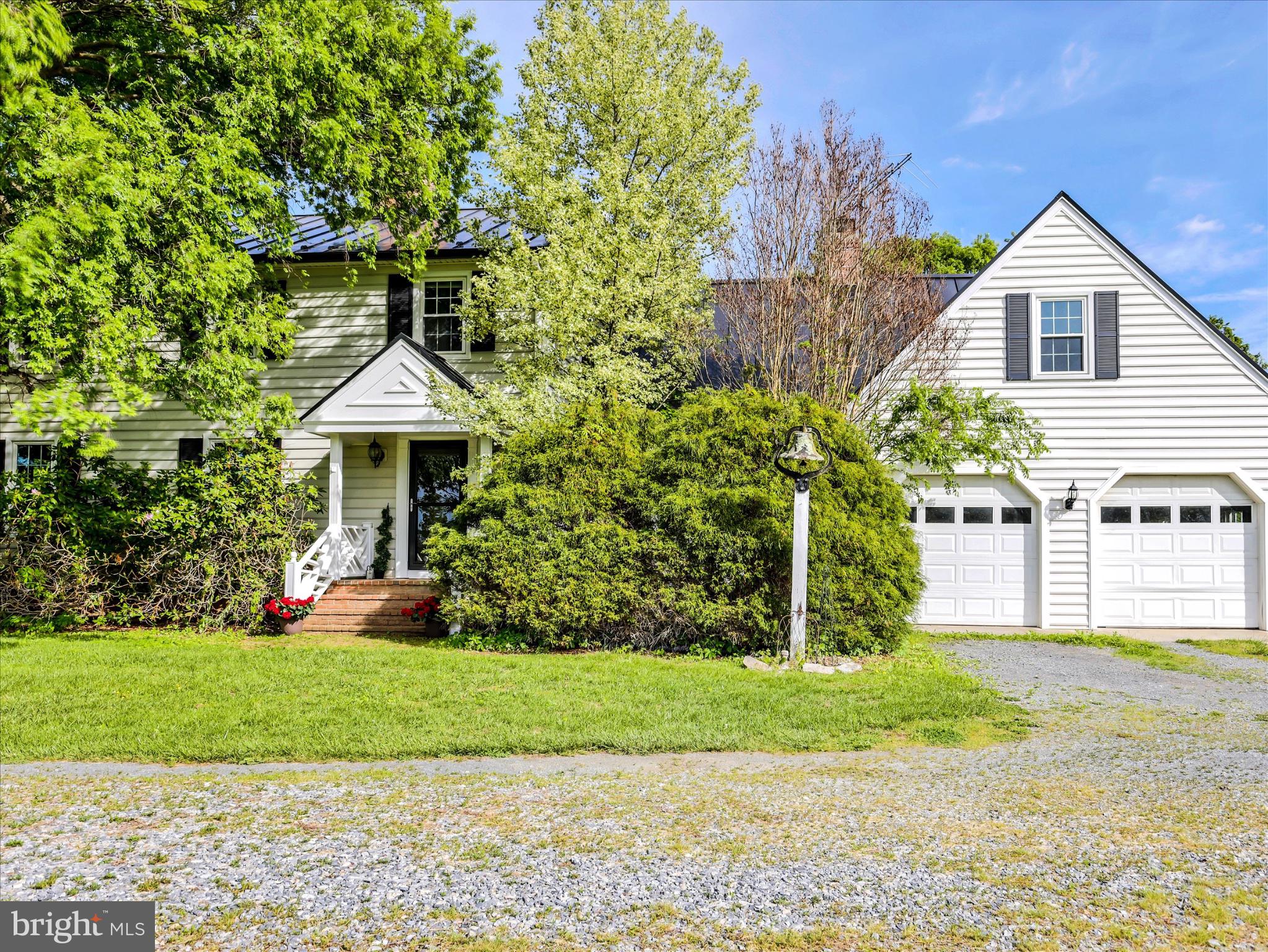 19255 Telegraph Springs Road Purcellville, VA 20132 - Photo 4 of 107 a front view of a house with a yard