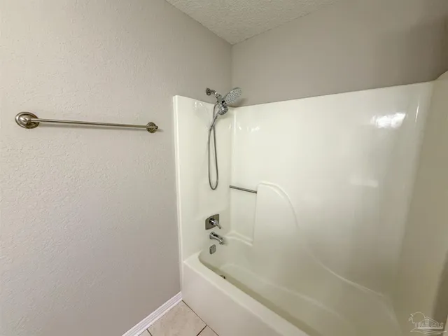 a bathroom with a shower and a shower