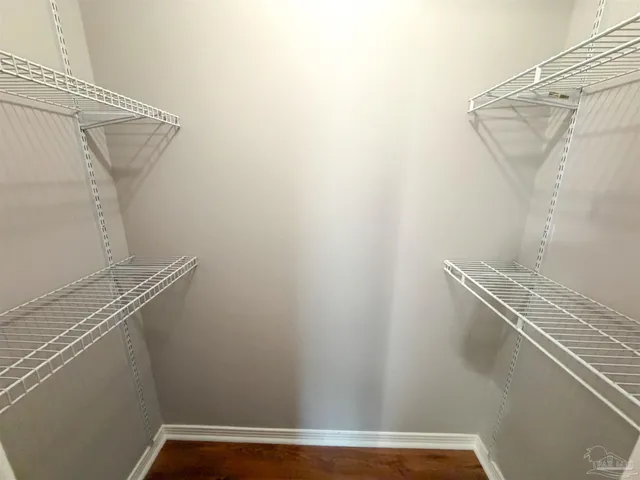 a view of a room with racks on the wall