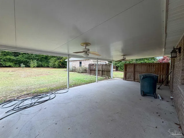 a view of a patio with a yard