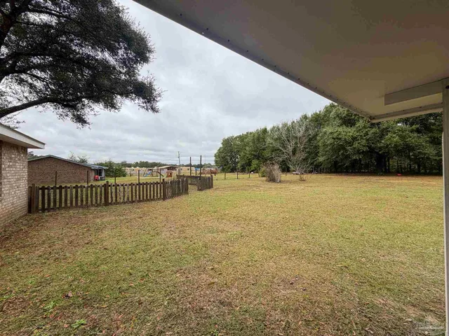 a view of a swimming pool with a balcony