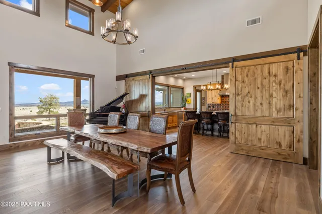 a living room with furniture and a book shelf